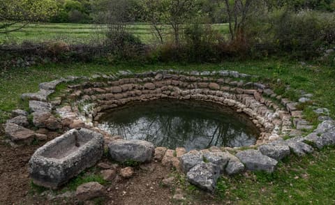 Neveš voda — the old stone well beside the necropolis of stećci